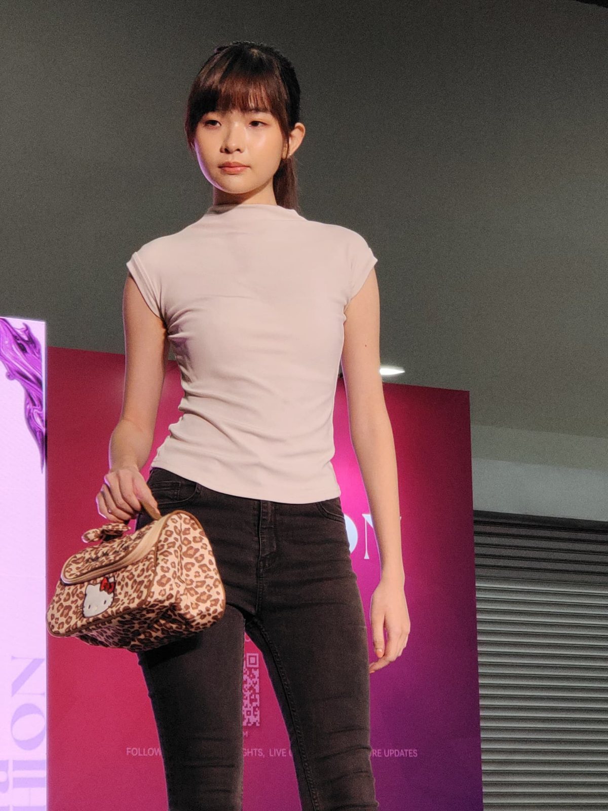 Front view on the runway with a leopard-print bag
