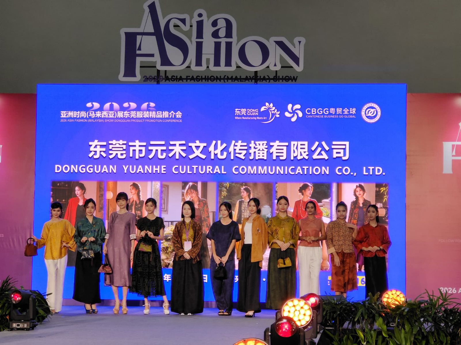 Finale line-up on stage in silk looks