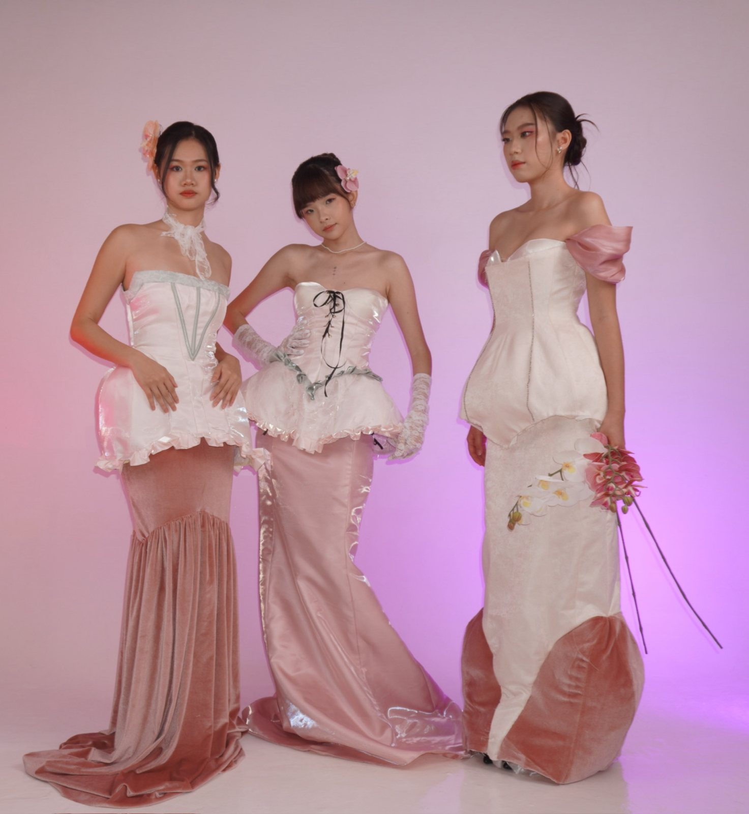 Three looks in blush satin and velvet on a pink backdrop