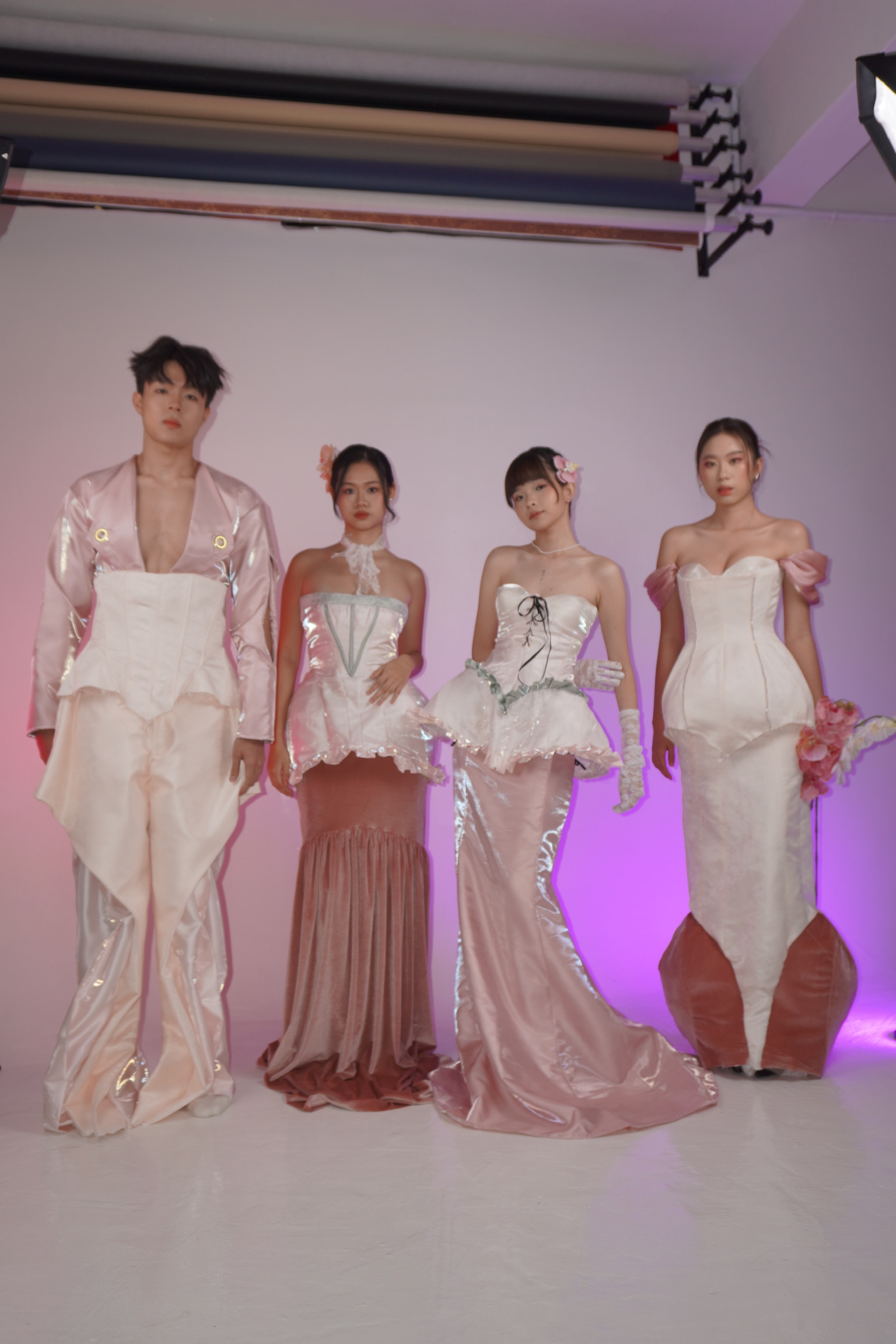 Four looks from the collection in the studio, full length