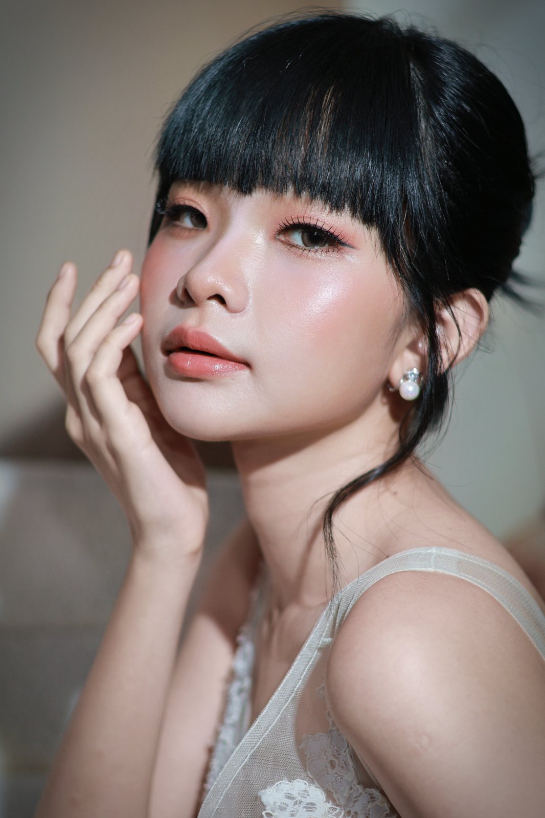 Bridal beauty portrait, hand at cheek