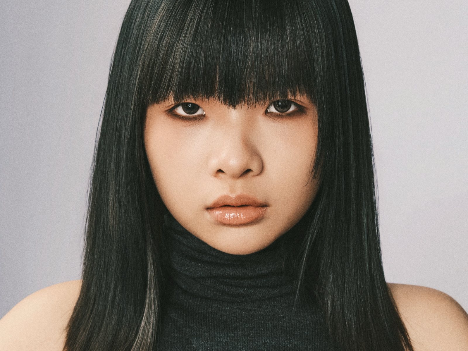 Editorial portrait, close-up in black turtleneck
