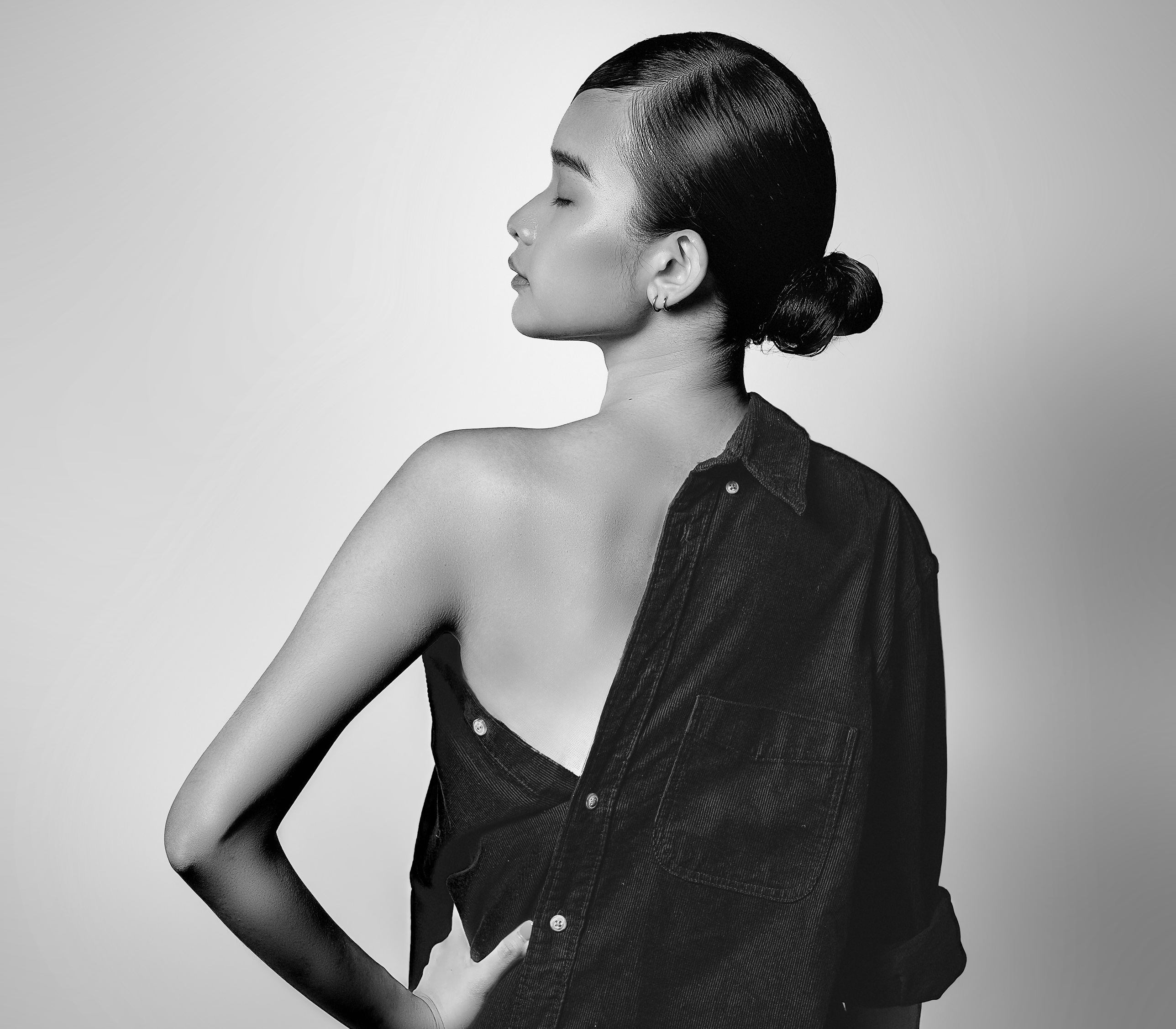 Black and white, back view with a bare shoulder
