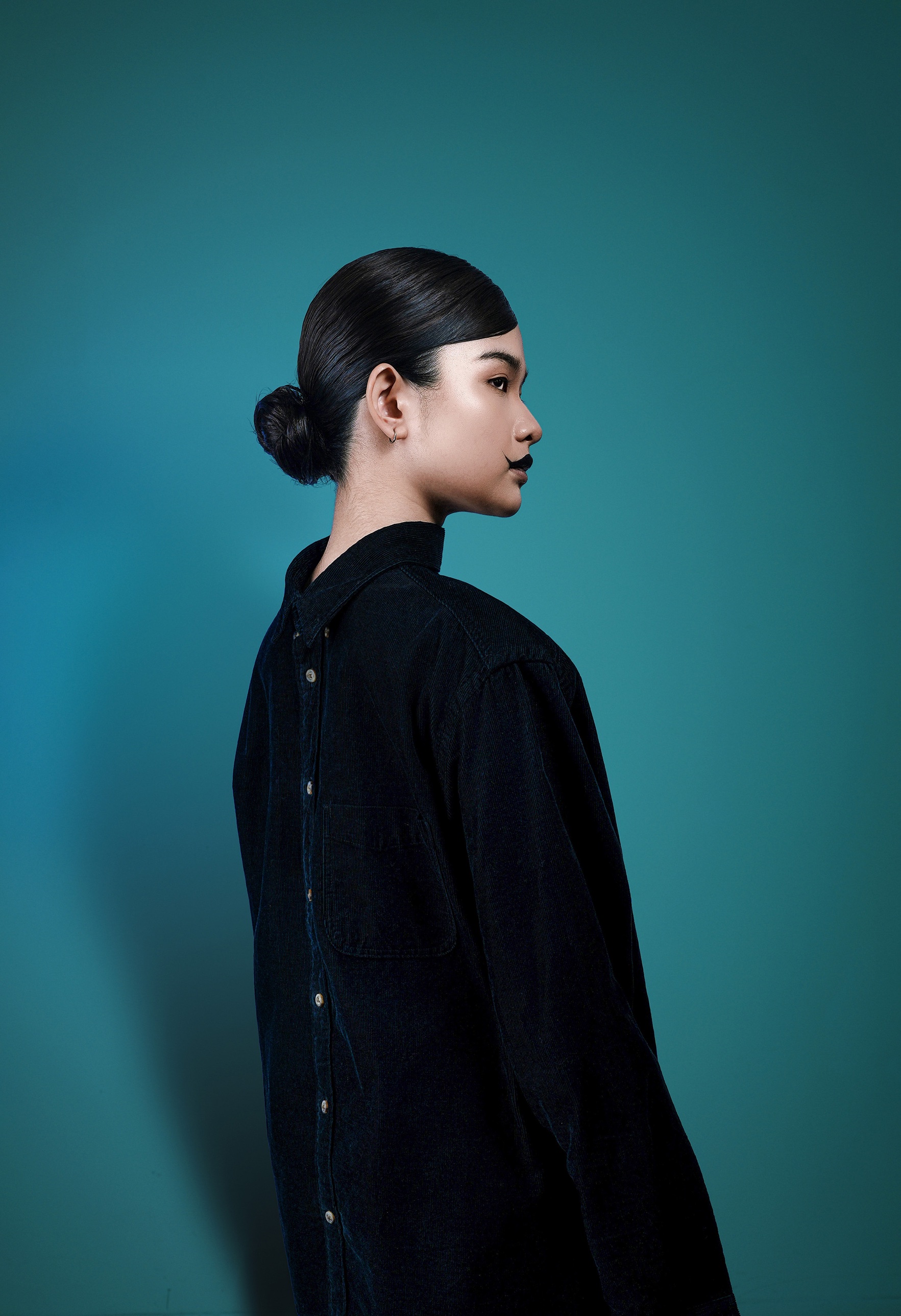 Profile with a painted moustache and black lips
