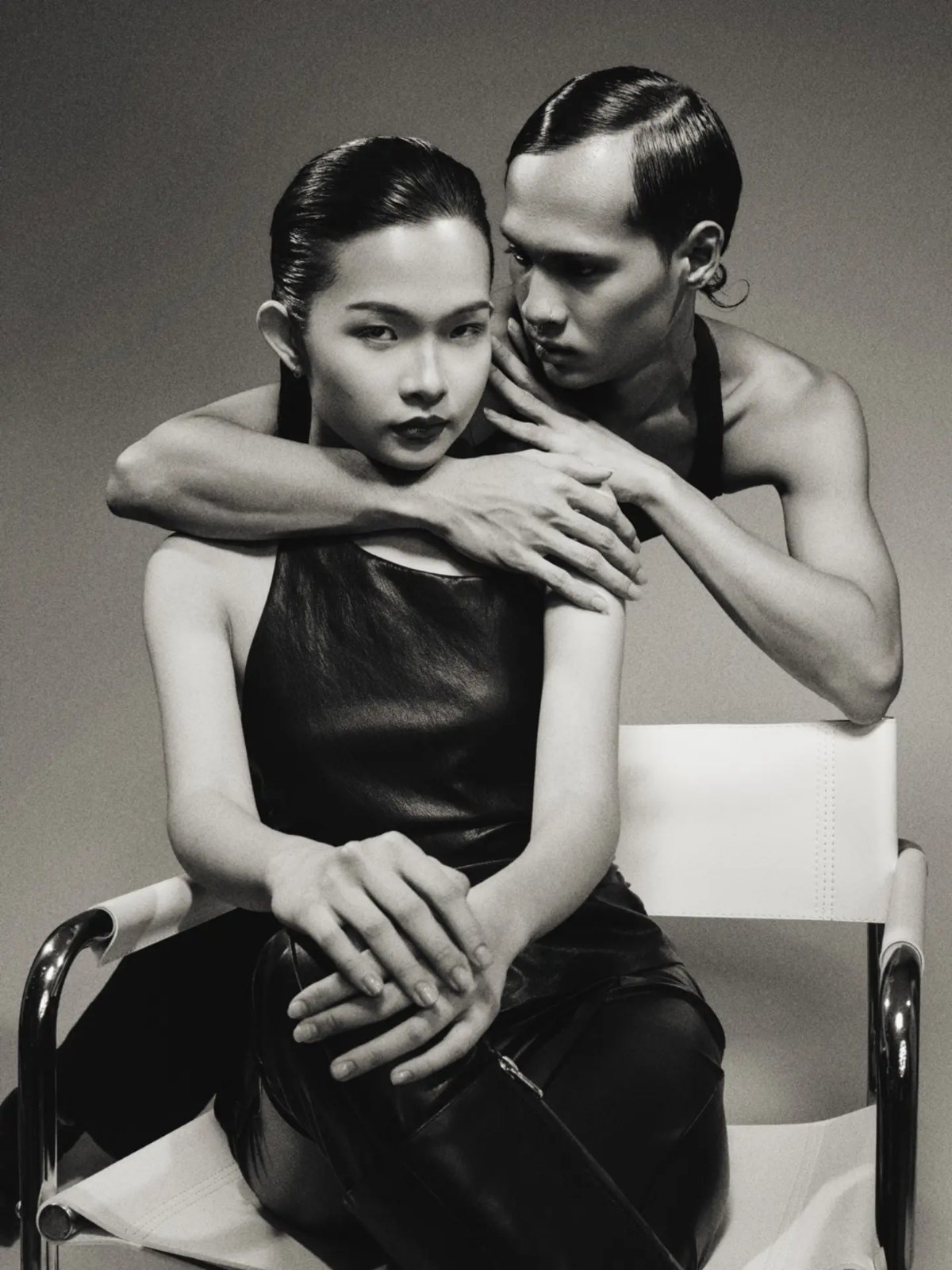 Black and white portrait, embraced on a chrome chair
