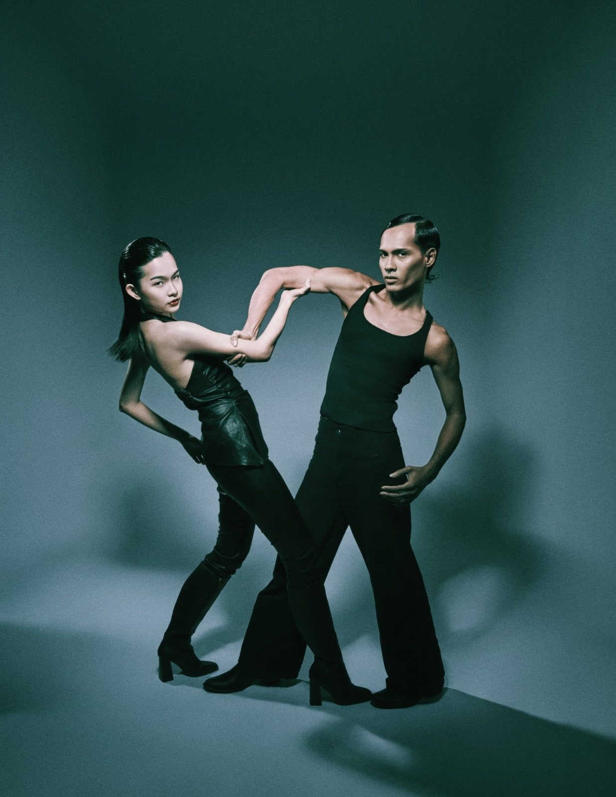 Duo portrait, arms linked in a dance pose
