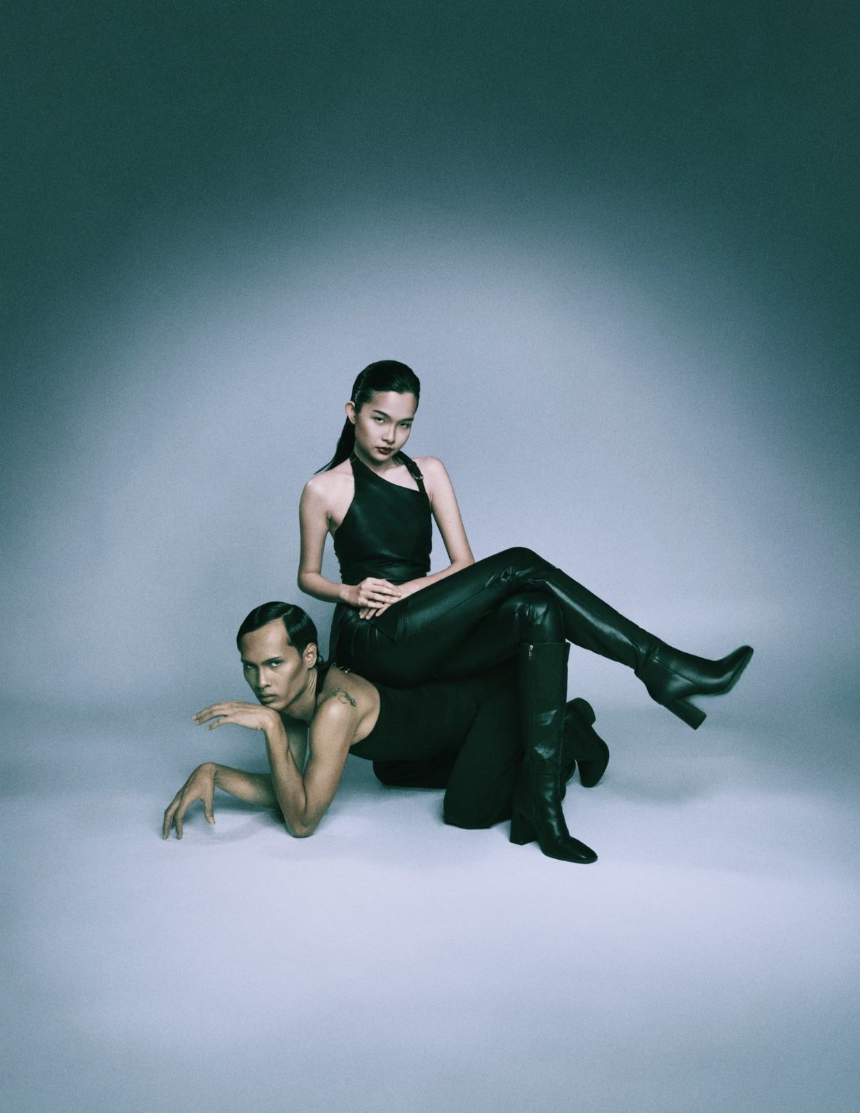 Duo portrait, seated on partner's back