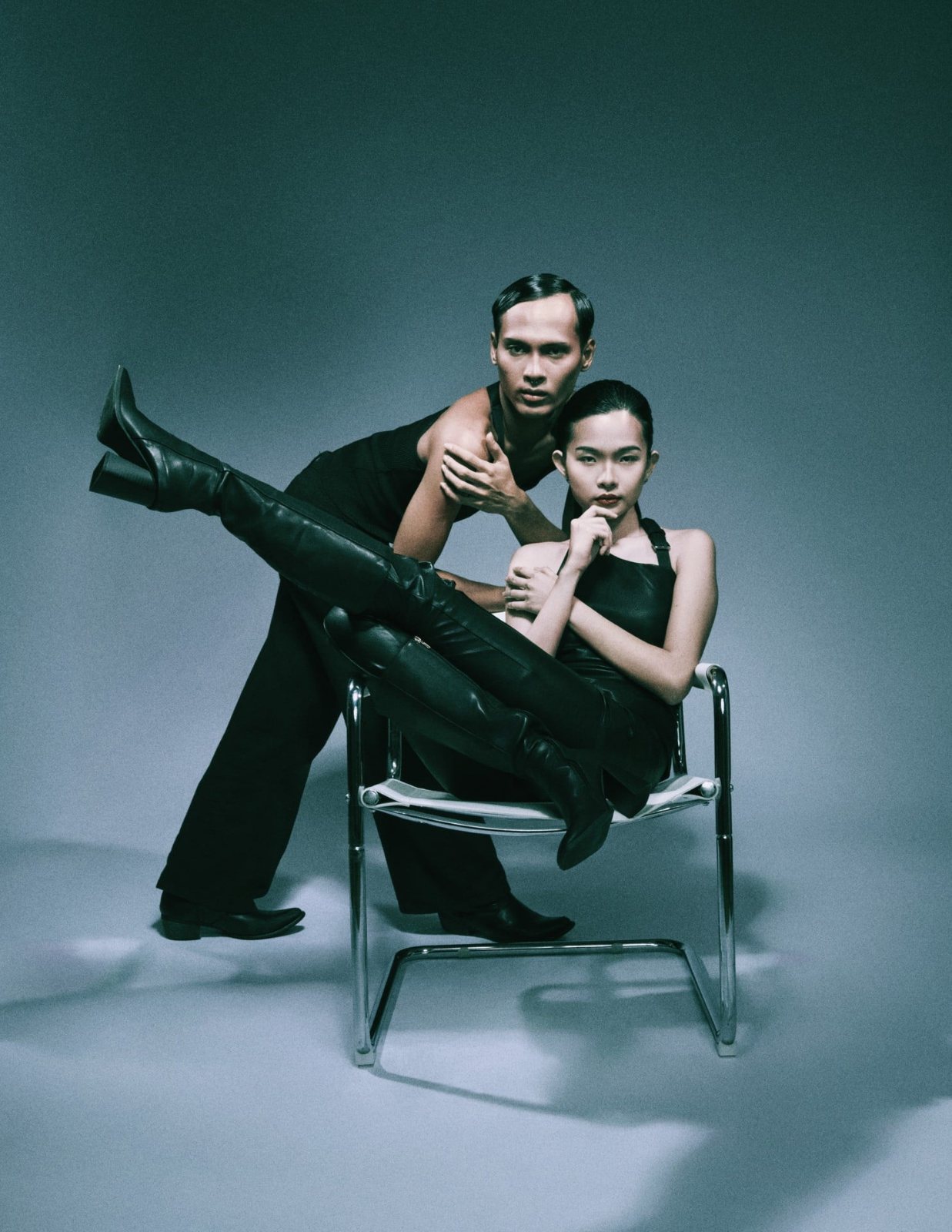 Duo portrait, reclining on a chrome chair