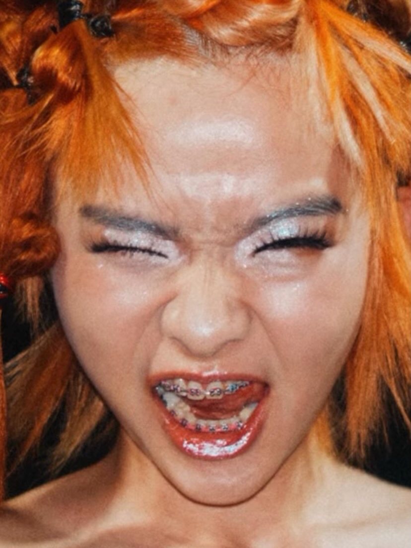 Backstage close-up, eyes shut mid-shout