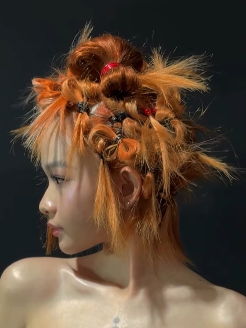 Backstage hair profile, sculpted copper knots