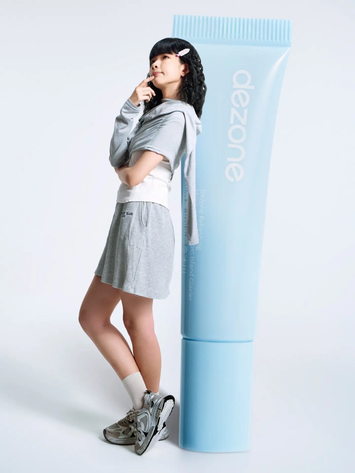 Lipstick campaign, leaning on giant tube