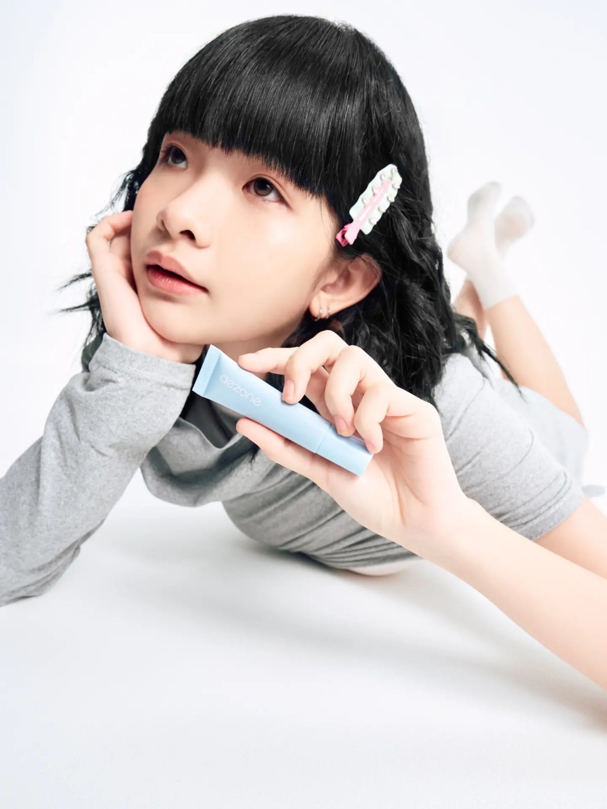 Lipstick campaign, looking up holding tube
