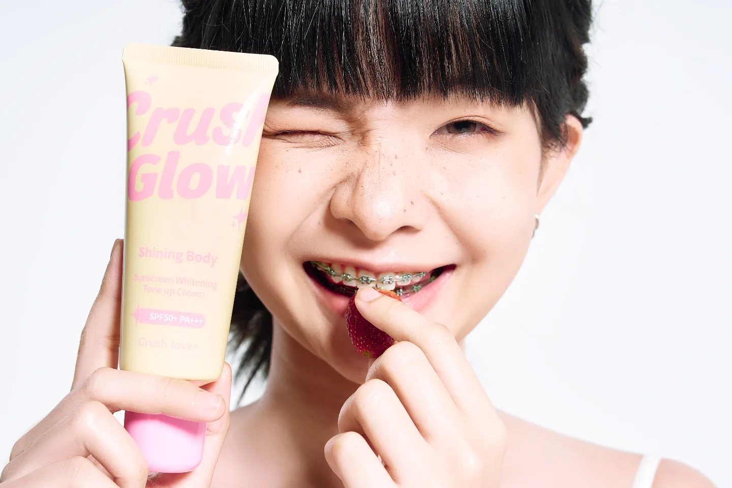 Sunscreen campaign, wink with strawberry