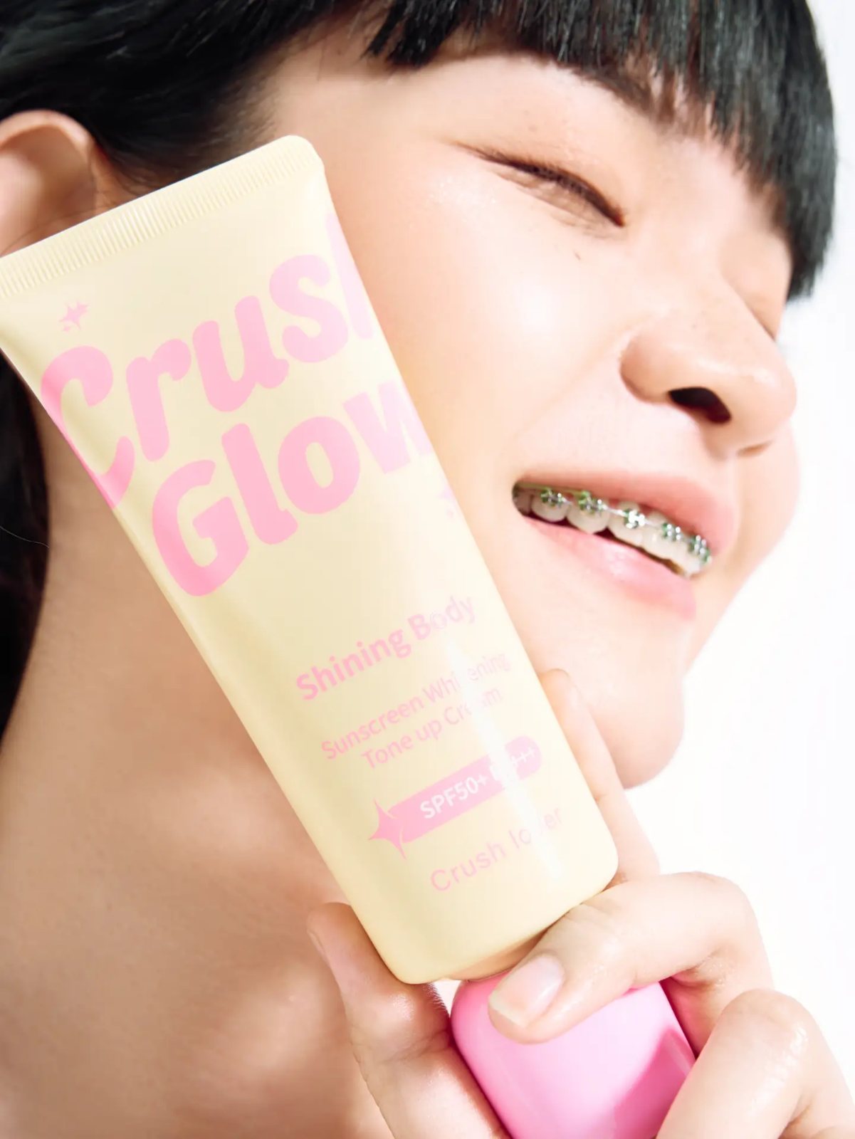 Sunscreen campaign, tube against cheek