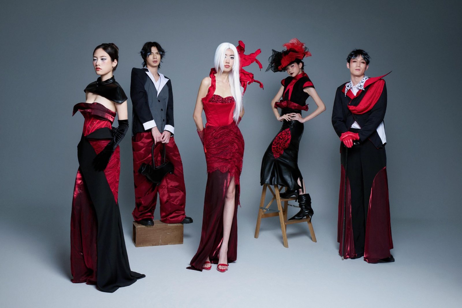 Full cast of five looks on a grey backdrop